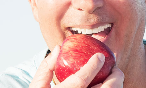 Model eating an apple